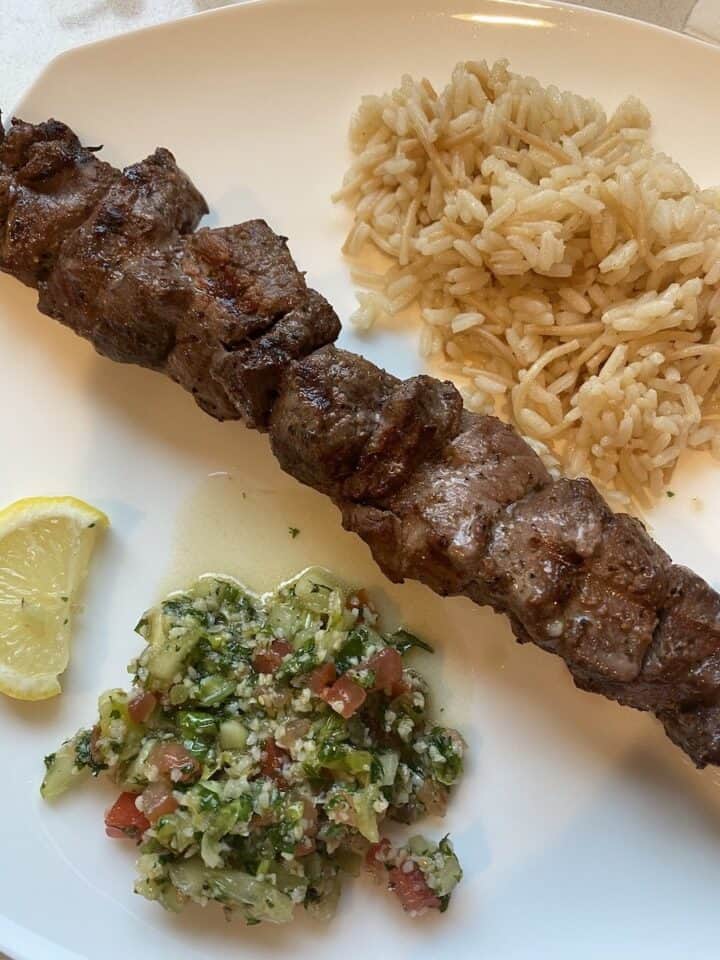Side of Armenian rice pilaf with shish kebab and tabouli