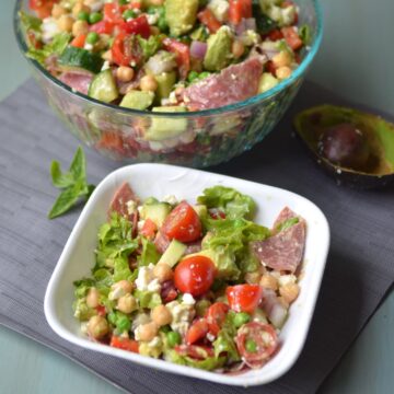 Large and small bowl of avocado chickpea salad