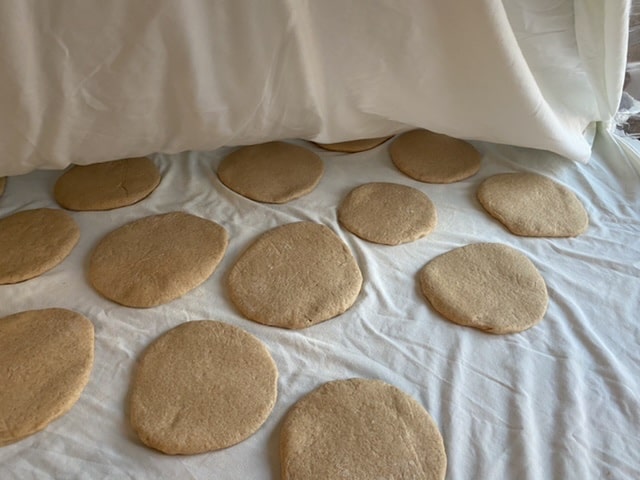 Flattened dough homemade whole wheat pita bread