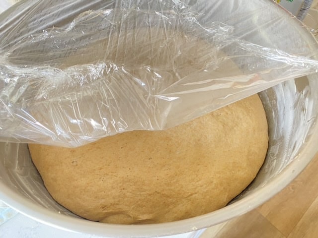 Rising dough for homemade whole wheat pita bread