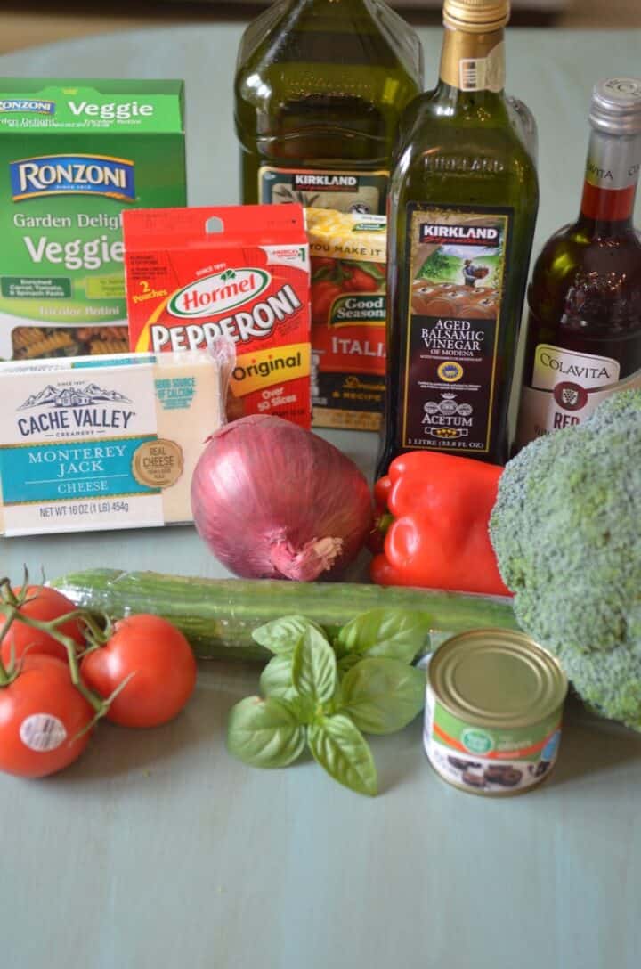 Ingredients for tricolor pasta salad with Italian dressing