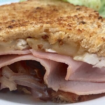 Brie grilled cheese sandwich with fig jam and ham.